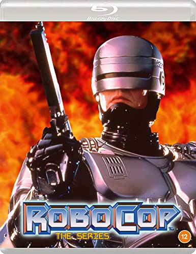 Robocop in silver armor holding a gun against a background of orange flames.