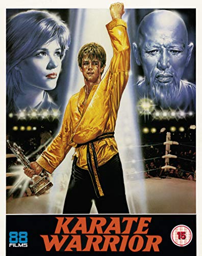 A karate fighter in a yellow gi stands between a woman and an old man.