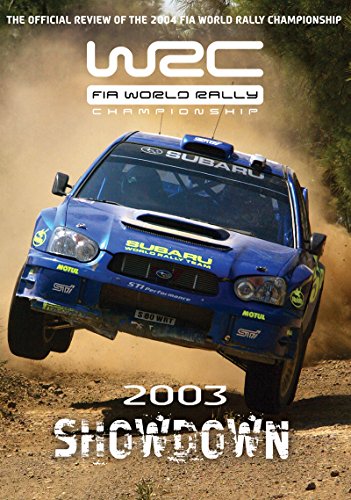 Blue Subaru rally car mid-air, DVD cover for World Rally Review 2003.