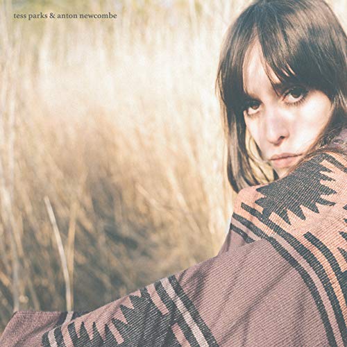 Album cover featuring a young woman with long hair and a patterned shawl.