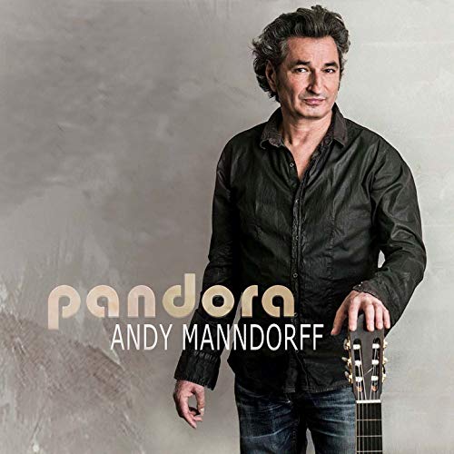 CD cover featuring a man with a guitar, gray background.