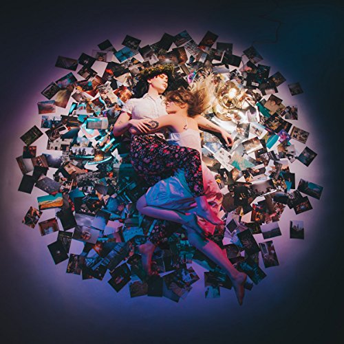 Two people embrace amidst a swirling collage of photographs.