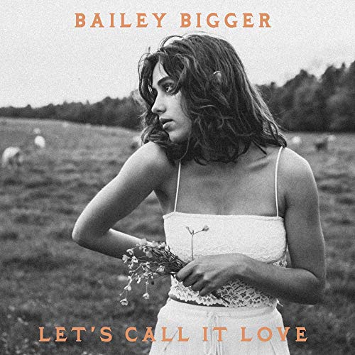 Vinyl record cover featuring a woman in a field holding flowers.