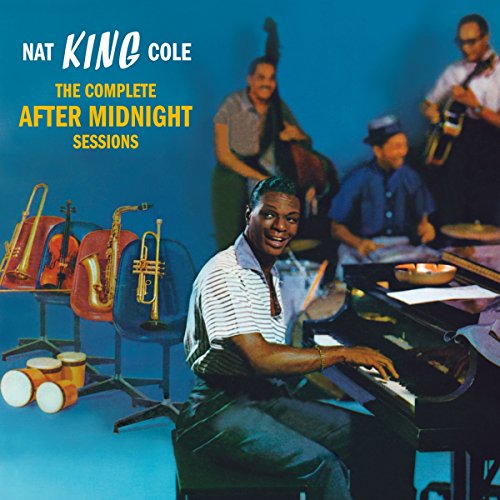 Nat King Cole at a piano with jazz musicians, album cover.