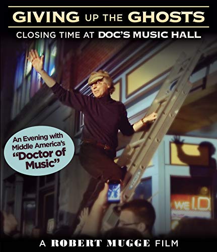 Blu-ray cover for "Giving Up The Ghosts" featuring a man on a ladder.