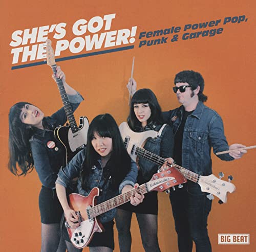 CD cover featuring three musicians playing guitars and drums, orange background.