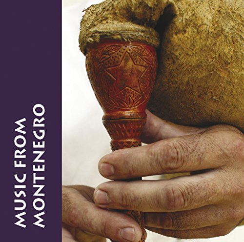 CD cover featuring a carved, gourd-like instrument held by hands.