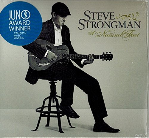 Steve Strongman sits with a guitar on a tall stool, album cover.
