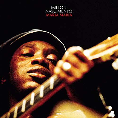 Milton Nascimento album cover, close-up of musician with guitar.