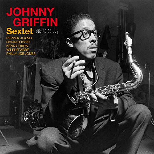 Johnny Griffin with saxophone, album cover in black and white.