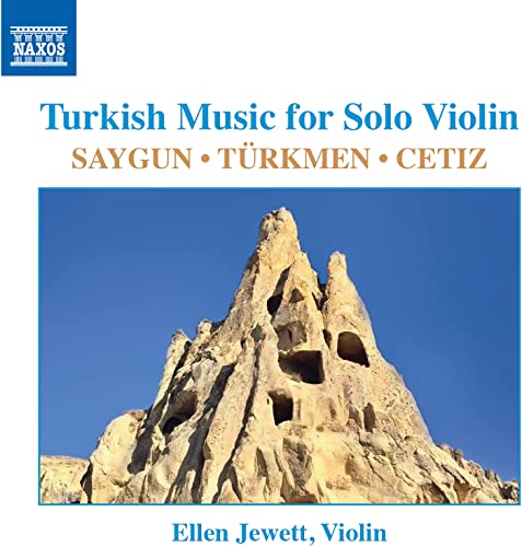 CD cover with a landscape of rock formations and text details.