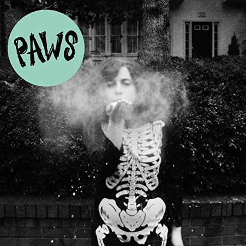 Black and white album cover featuring a person blowing smoke, skeleton print.