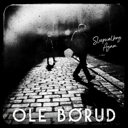 Black and white album cover featuring two figures on a brick road.