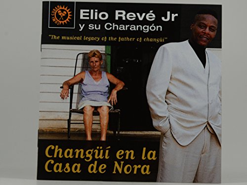 CD cover featuring Elio Revé Jr. and a woman in front of a house.