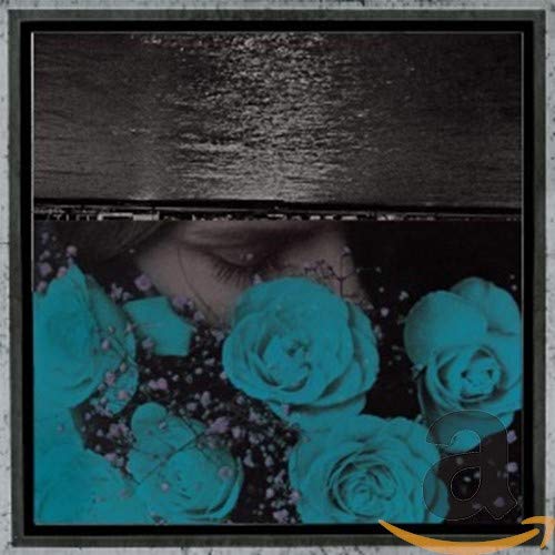 CD cover with a person obscured by turquoise roses and dark sky.