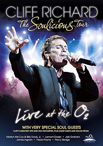 Cliff Richard performing live on stage, DVD cover image.