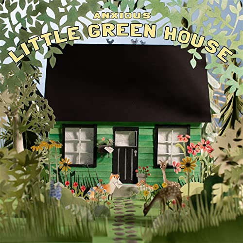 Papercraft image of a green house with deer and foxes in foliage.