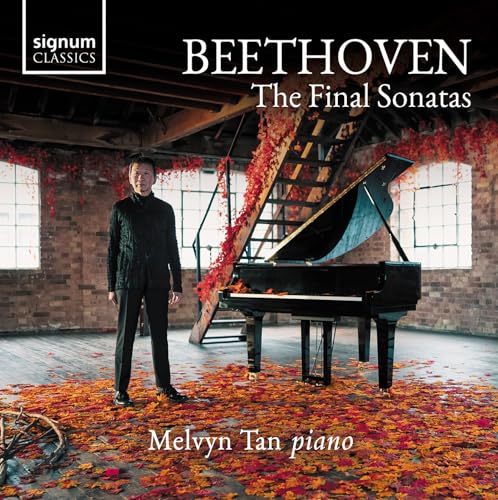 CD cover: Melvyn Tan with a grand piano in a rustic, autumnal setting.