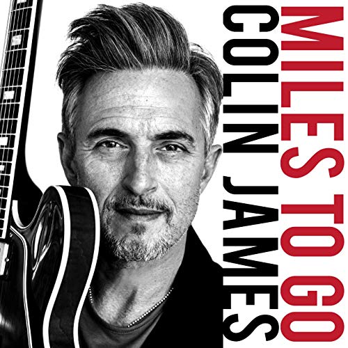 Black and white portrait of Colin James with guitar, album title text.