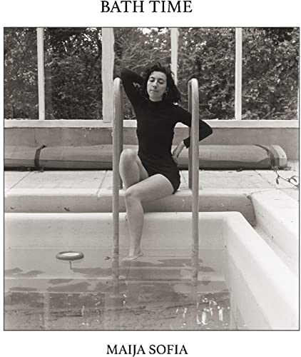 Black and white album cover featuring a woman by a swimming pool.