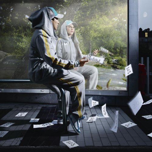 CD cover featuring two hooded figures in a bus shelter scene.