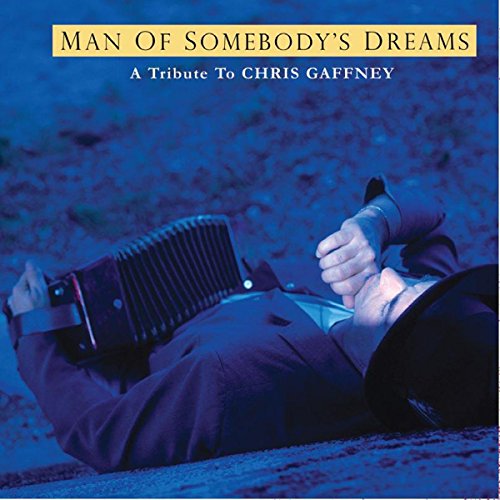 CD cover: man in suit reclining with an accordion, blue background.