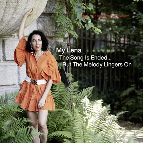 CD cover featuring a woman in an orange dress posing near greenery.