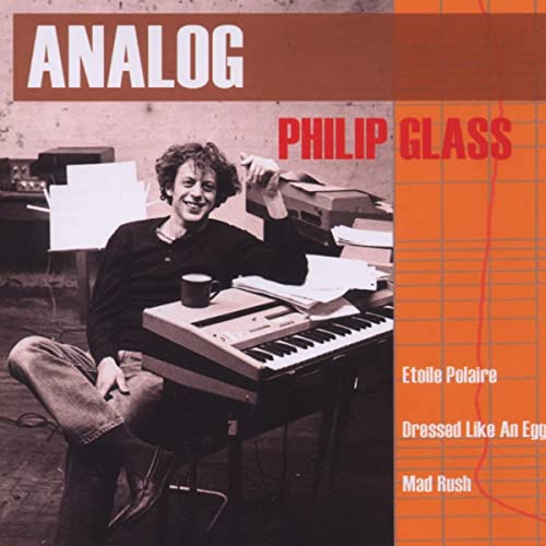 CD cover featuring Philip Glass at a keyboard with sheet music.