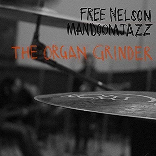 Black and white photo of cymbals with red text: "The Organ Grinder".