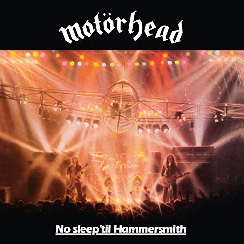 Motörhead band performing live on stage under bright lights for No Sleep 'til Hammersmith.
