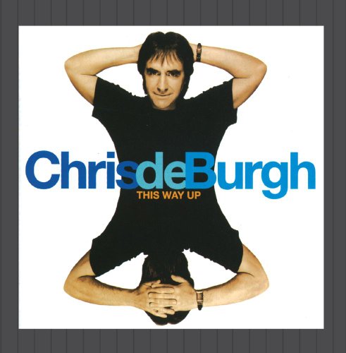 Chris de Burgh album cover, artist upside down in black clothing.