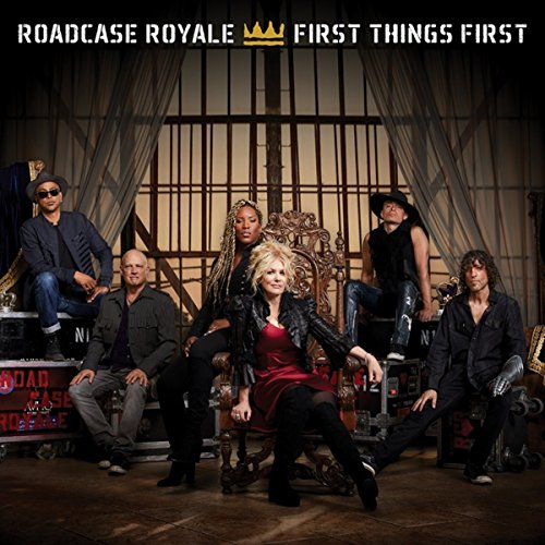 Roadcase Royale band portrait with ornate chair, stage backdrop.