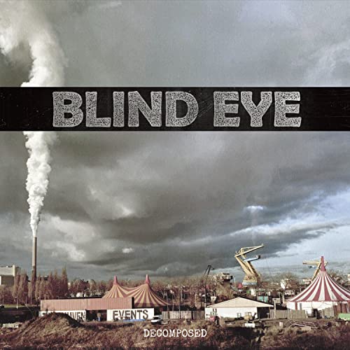Album cover: "Blind Eye - Decomposed" with a carnival and smokestack.