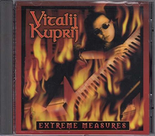 CD cover featuring a musician with a keyboard engulfed in flames.