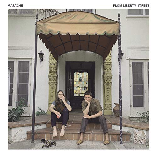 CD cover: two people seated on steps under an ornate awning.