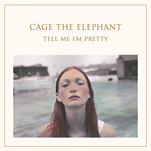 Album cover featuring a woman with red hair standing in front of a pool.