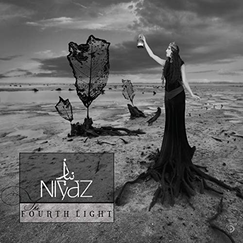 Album cover: woman holding a lantern in a desolate, surreal landscape.