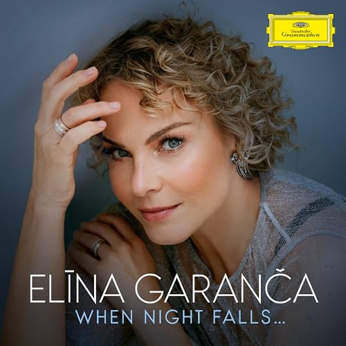 Close-up portrait of Elīna Garanča, a woman with curly hair, for a CD.
