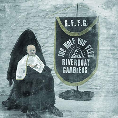 CD cover: hooded figure with a baby, banner reading "The Wolf You Feed".