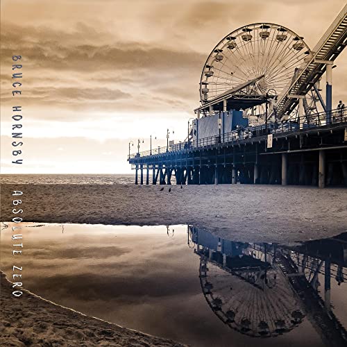 CD cover: Pier with Ferris wheel reflected in wet sand.