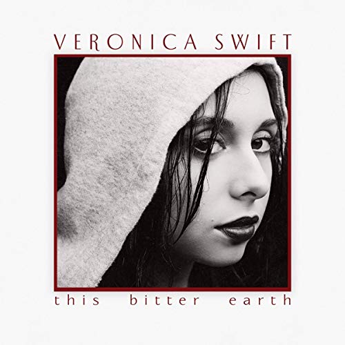 Black and white portrait of Veronica Swift with a hooded cowl.