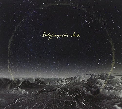CD cover: dark landscape with starry sky and circular writing.
