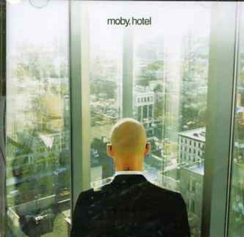 Moby’s “Hotel” CD cover: bald man looking out a city window.