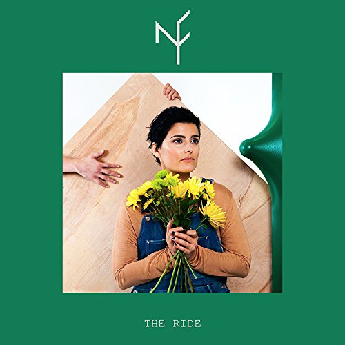 Nelly Furtado holding yellow flowers, album cover for "The Ride".