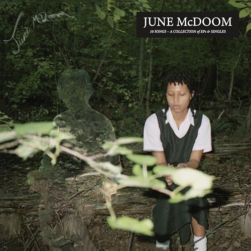CD cover for June McDoom featuring a woman and ghostly figure in woods.
