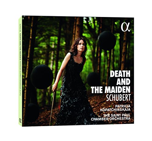 CD cover: woman in black dress among dark spheres in a forest.