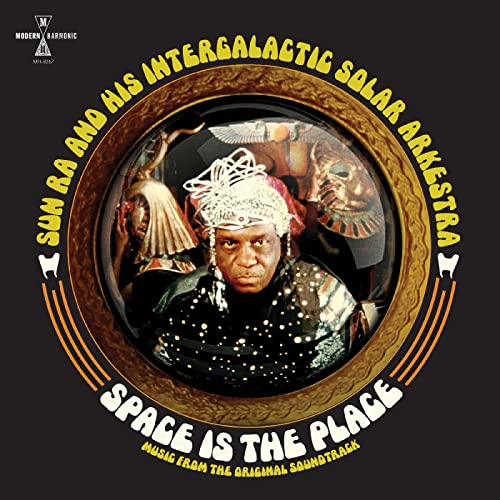 Album cover for Sun Ra’s “Space Is The Place” featuring a portrait and cosmic imagery.