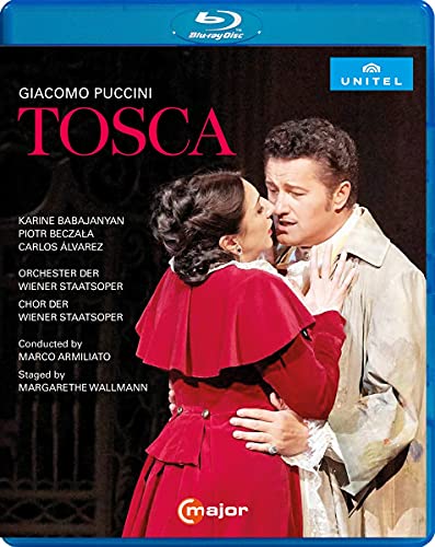 Blu-ray cover for Puccini’s *Tosca* featuring two opera singers embracing.