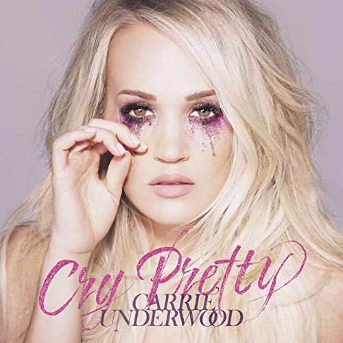 Blonde woman with makeup tears on her face and album title overlaid.