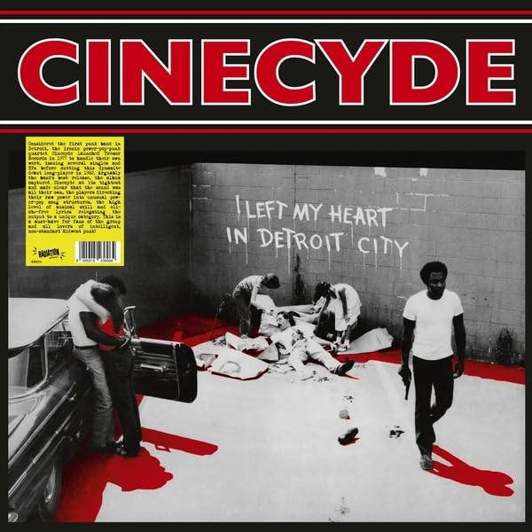 Red vinyl record cover with black and white image of men with a car.